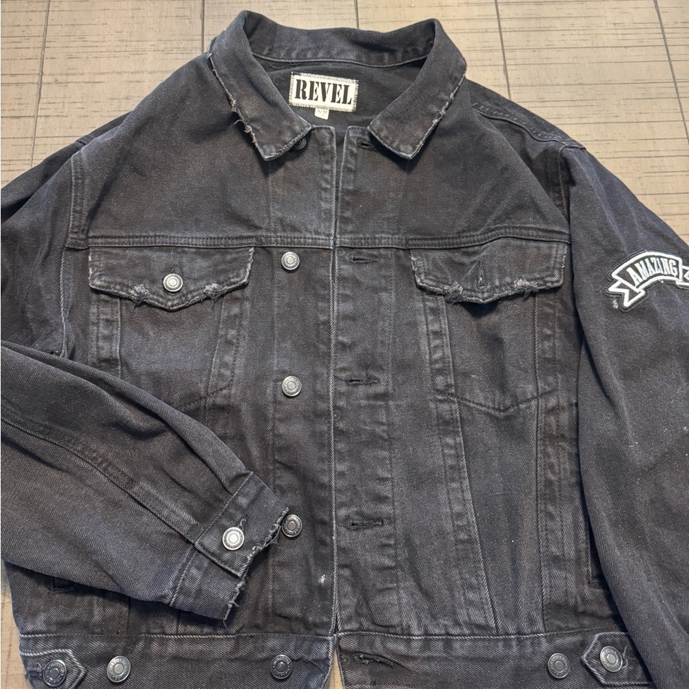 Revel black Jean jacket with sequin angel wings on back.